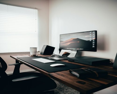 A clean, organized desk with soft natural light